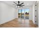Bright bedroom with hardwood floors and sliding glass door to backyard at 2650 Zenobia, Denver, CO 80212
