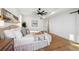 Light and airy bedroom with hardwood floors and access to ensuite bathroom at 2650 Zenobia, Denver, CO 80212