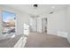 Bright bedroom with carpet flooring and access to a private balcony at 2650 Zenobia, Denver, CO 80212