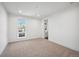 Well-lit bedroom with carpet flooring and an ensuite bathroom at 2650 Zenobia, Denver, CO 80212
