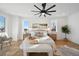 Spacious bedroom featuring hardwood floors, large windows, and a ceiling fan at 2650 Zenobia, Denver, CO 80212