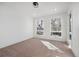 Spacious bedroom with carpet flooring, large windows and an ensuite bathroom at 2650 Zenobia, Denver, CO 80212