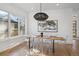 Elegant dining room with a large wood table and modern chairs at 2650 Zenobia, Denver, CO 80212
