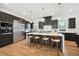 Modern kitchen with dark cabinetry, quartz countertops, and island at 2650 Zenobia, Denver, CO 80212