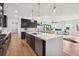 Modern kitchen with an expansive island and stainless steel appliances at 2650 Zenobia, Denver, CO 80212