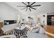 Open concept living room with fireplace and hardwood floors at 2650 Zenobia, Denver, CO 80212