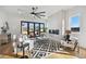 Open living room featuring a fireplace and hardwood floors at 2650 Zenobia, Denver, CO 80212