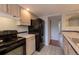 Bright kitchen features black appliances and light wood cabinets at 2972 Shady W Holw, Boulder, CO 80304