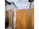 Wooden gate provides access to the backyard at 14561 E 46Th Ave, Denver, CO 80239