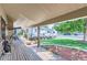 Covered porch with a swing, offering views of the street and yard at 10021 Miller St, Broomfield, CO 80021