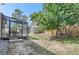 Backyard with a sunroom, shed, and a partially fenced area at 10021 Miller St, Broomfield, CO 80021