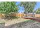 Fenced backyard with a trampoline and mature trees at 10021 Miller St, Broomfield, CO 80021