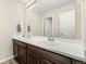 Bathroom with double vanity and large mirror at 2125 E 150Th Pl, Thornton, CO 80602