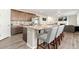 Kitchen with large granite island and breakfast bar seating at 2125 E 150Th Pl, Thornton, CO 80602