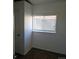 Small bedroom with carpet, window, and closet at 3228 W Virginia Ave, Denver, CO 80219