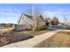 Side view of the house showing landscaping and a fence at 5535 Danube St, Denver, CO 80249