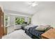 Main bedroom with bay windows, ceiling fan, and carpeted floors at 13369 Downing St, Thornton, CO 80241