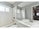 Clean bathroom with white subway tile and a bathtub at 11615 Masonville Dr, Parker, CO 80134