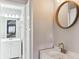 Bathroom with white vanity and a stylish gold faucet at 11615 Masonville Dr, Parker, CO 80134
