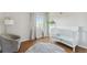 bedroom with hardwood floors and a white crib at 11615 Masonville Dr, Parker, CO 80134