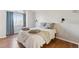 Cozy bedroom with hardwood floors and a neutral color palette at 11615 Masonville Dr, Parker, CO 80134