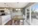 Farmhouse style dining area with sliding glass door to backyard at 11615 Masonville Dr, Parker, CO 80134