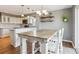 Bright dining area with farmhouse table and view of kitchen at 11615 Masonville Dr, Parker, CO 80134
