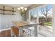 Bright dining area with farmhouse table and sliding glass door to backyard at 11615 Masonville Dr, Parker, CO 80134