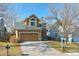 Two-story house with a two-car garage and landscaped yard at 11615 Masonville Dr, Parker, CO 80134