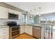 Modern kitchen with stainless steel appliances and granite countertops at 11615 Masonville Dr, Parker, CO 80134