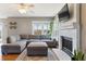 Cozy living room featuring a sectional sofa and fireplace at 11615 Masonville Dr, Parker, CO 80134