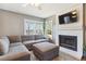 Cozy living room featuring a sectional sofa and fireplace at 11615 Masonville Dr, Parker, CO 80134