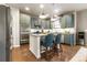 Modern kitchen with blue cabinets and stainless steel appliances at 8827 Gore St, Arvada, CO 80007