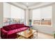 Cozy sitting area with a velvet sofa and unique coffee table at 3077 S Acoma St, Englewood, CO 80110