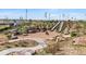 Two-slide playground with rock retaining wall and path at 21202 E 63Rd Dr, Aurora, CO 80019