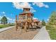 Wooden play structure with climbing nets and slides at 21202 E 63Rd Dr, Aurora, CO 80019