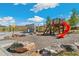 Play area with slides, climbing wall, and basketball court at 21202 E 63Rd Dr, Aurora, CO 80019