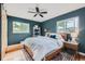 Bright bedroom with wood-paneled accent wall and modern decor at 13194 W 23Rd Ave, Golden, CO 80401