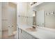 Another view of the bathroom showcasing the vanity, toilet, and doorway at 1915 S Balsam St, Lakewood, CO 80227