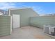 Exterior view of the home's back area with a storage closet and AC unit at 1915 S Balsam St, Lakewood, CO 80227