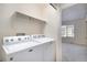 Convenient laundry room with a stacked washer and dryer at 1915 S Balsam St, Lakewood, CO 80227