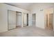 Spacious main bedroom with mirrored closet doors, carpeted flooring, and vaulted ceilings at 1915 S Balsam St, Lakewood, CO 80227