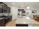 Modern kitchen with granite countertops and stainless steel appliances at 108 Monarch St, Bennett, CO 80102