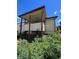 Elevated back deck with stairs and covered patio area at 2125 S Telluride Ct, Aurora, CO 80013