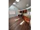 Kitchen with vaulted ceiling, wood cabinets, and vinyl flooring at 2125 S Telluride Ct, Aurora, CO 80013
