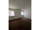 Well-lit bedroom with two windows and brown carpeting at 2125 S Telluride Ct, Aurora, CO 80013