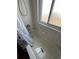 Bathroom with a shower/tub combo and a window for natural light at 2125 S Telluride Ct, Aurora, CO 80013