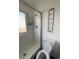 Clean bathroom with a shower, toilet, and window at 2125 S Telluride Ct, Aurora, CO 80013