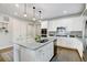 Modern kitchen with white cabinets, granite countertops, and stainless steel appliances at 61 Western Sky Cir, Longmont, CO 80501