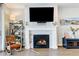 Living room with fireplace, hardwood floors, and large windows at 61 Western Sky Cir, Longmont, CO 80501